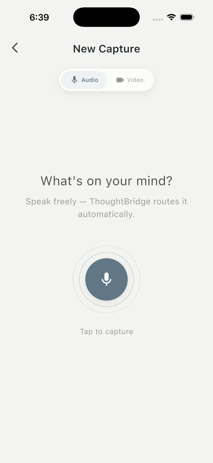 Recording a thought on iPhone — the capture orb with ripple rings and a live transcript